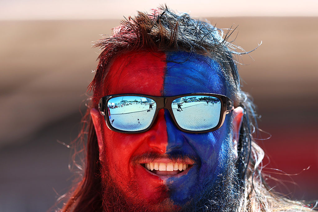 A fan with his face painted