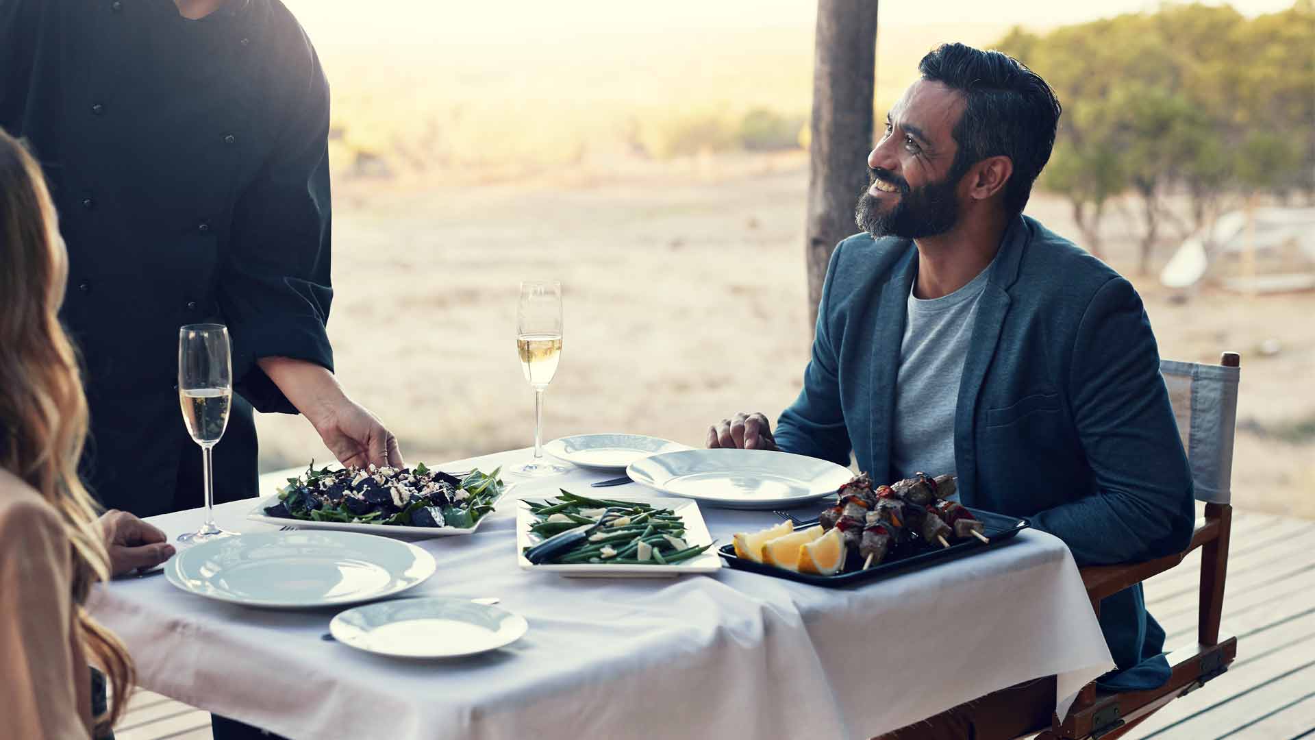 Man being served at a restaurant.