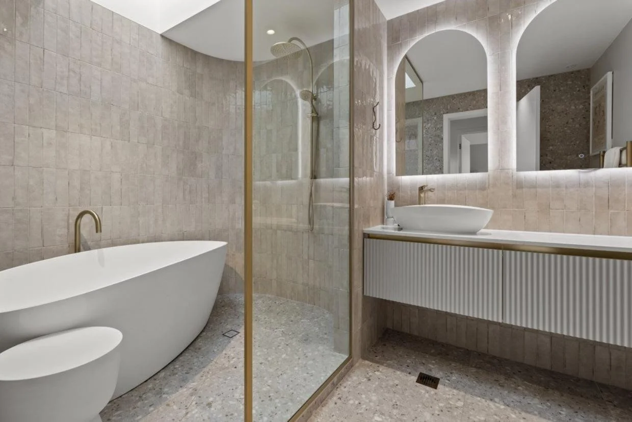 Bathroom of the home including fluted tile door vanity.
