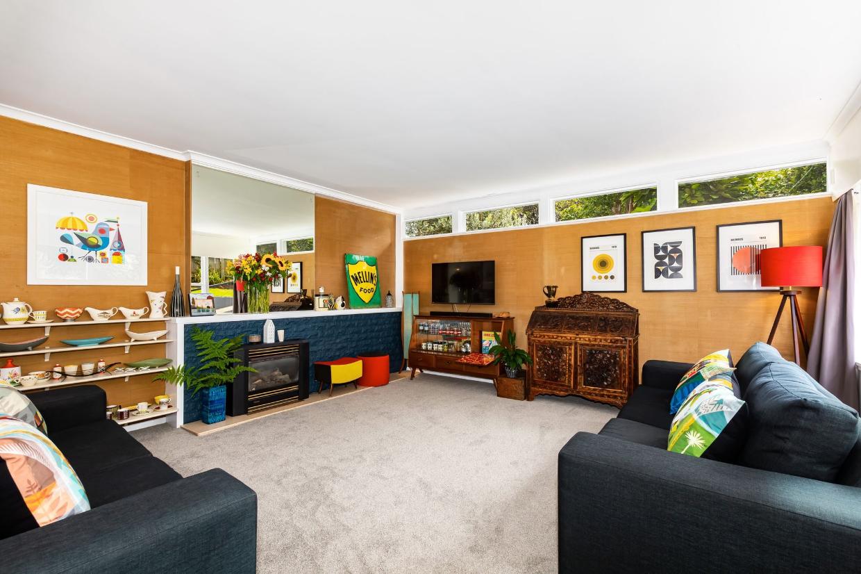 The lounge room has retained its original character. 