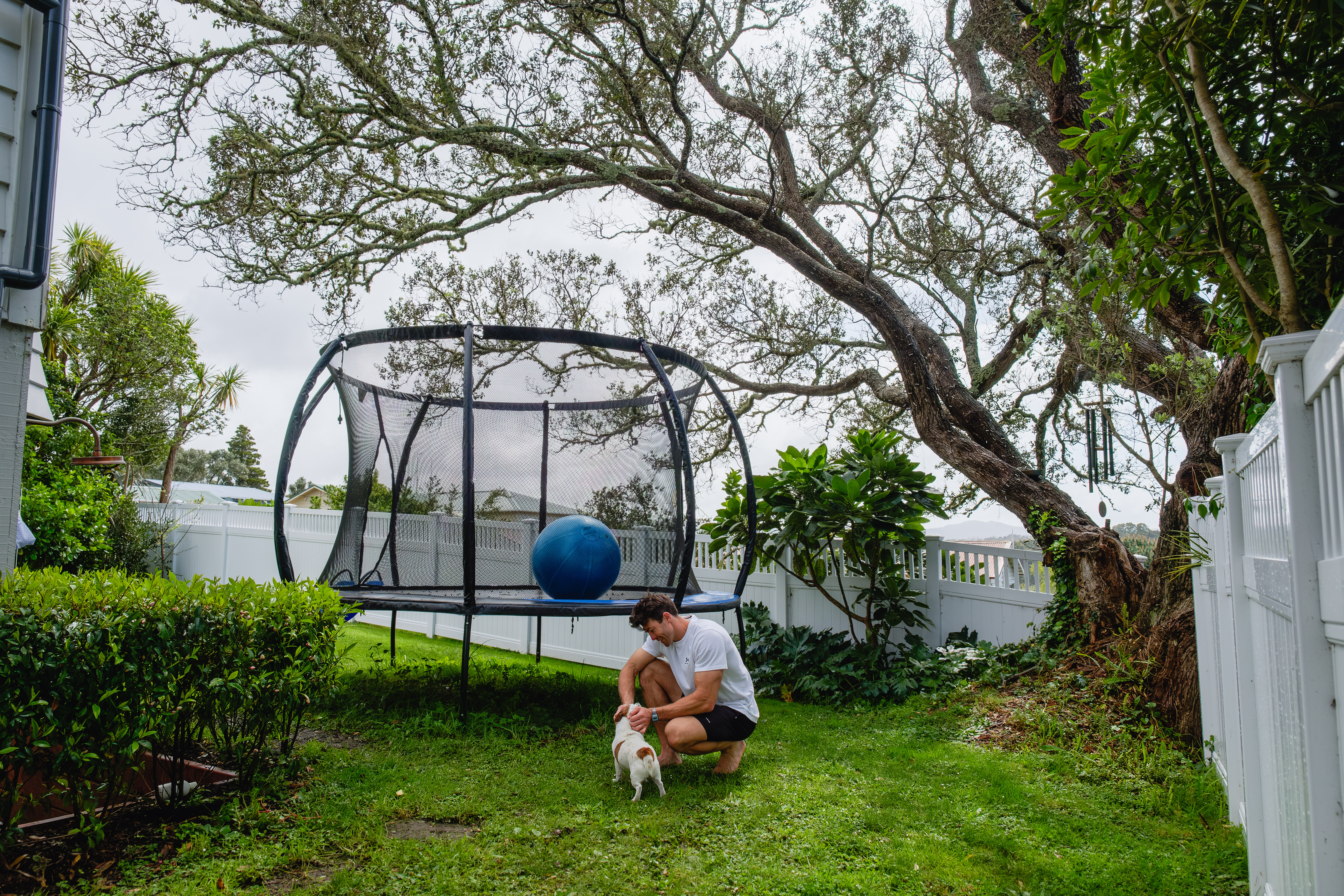 Art with his dog in the backyard