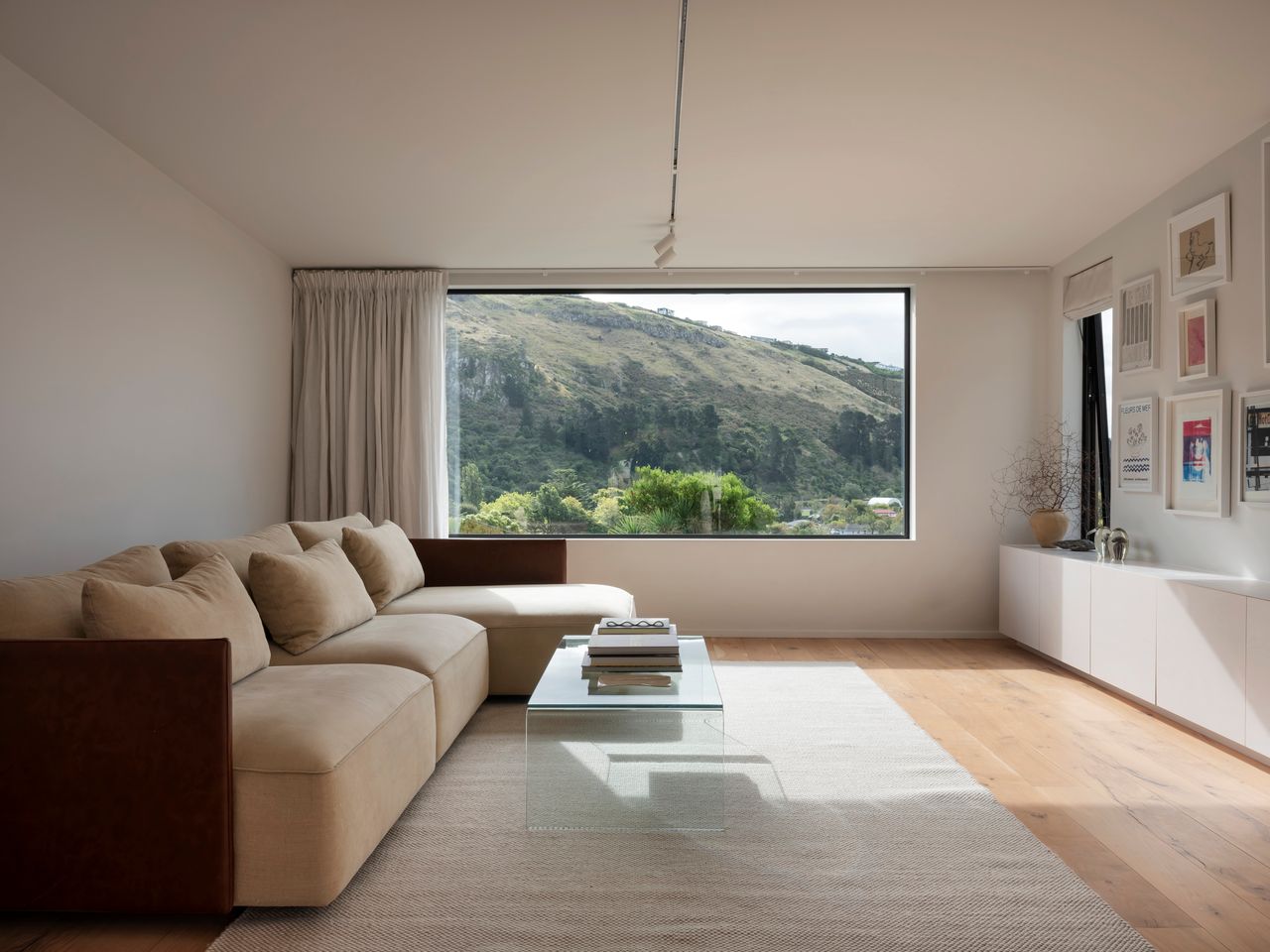 Living room with large window and outdoor view.