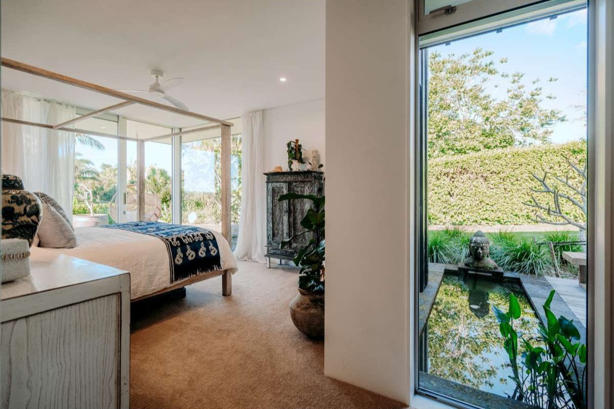 Master bedroom with water feature view