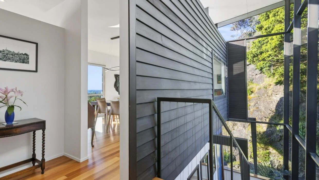 The home has an impressive glass entranceway.