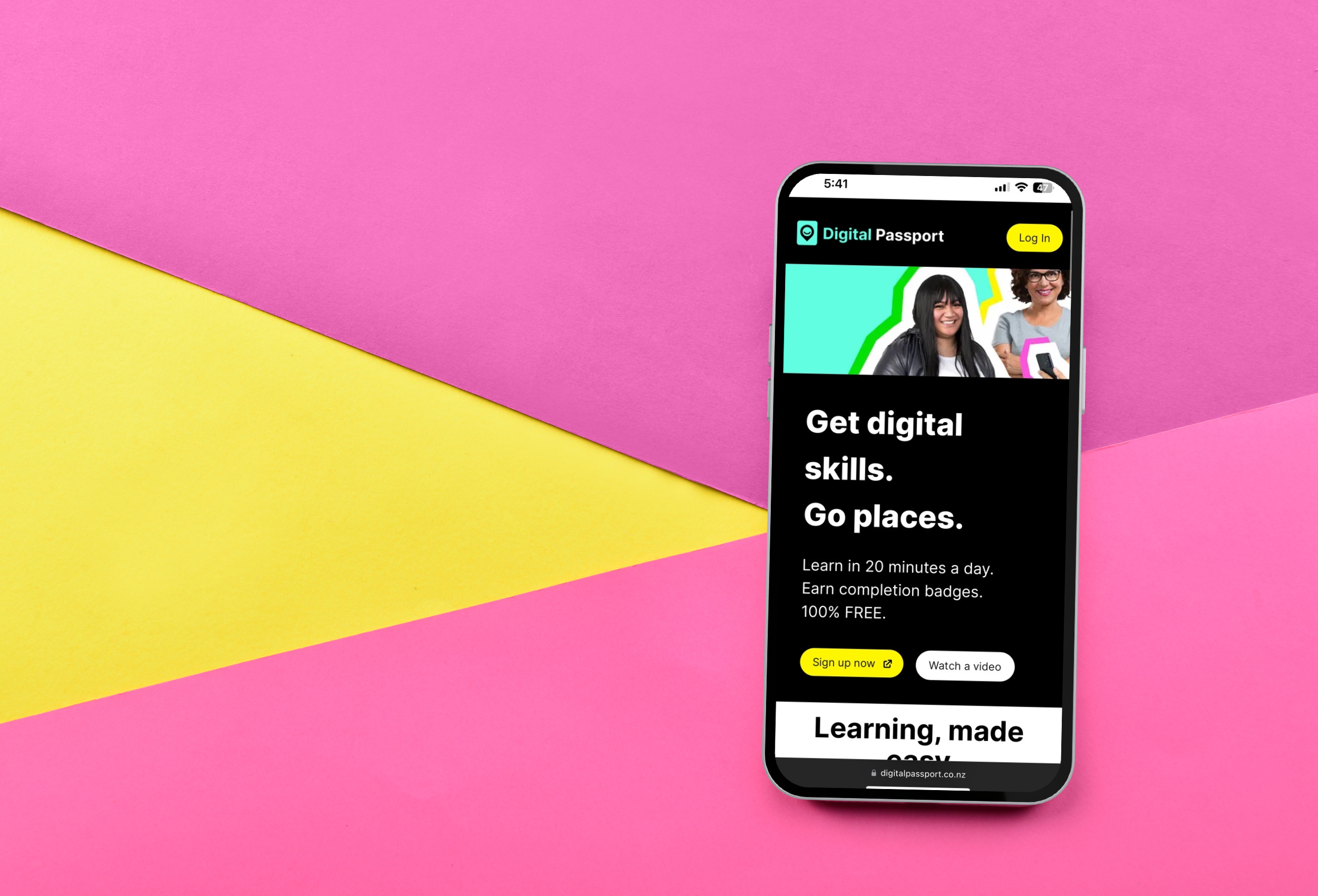 Phone in front of a pink and yellow background. Phone screen is showing the Digital Passport homepage.