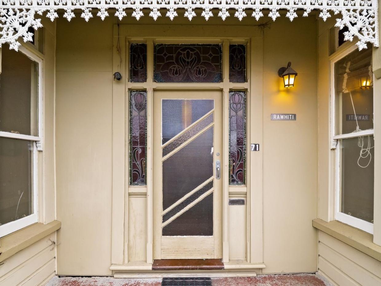 The original iron fretwork still adorns the front porch. Photo: BE Real Estate