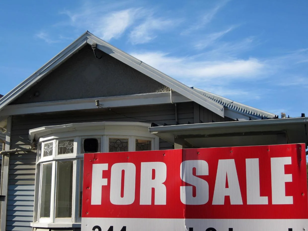 House with for sale sign