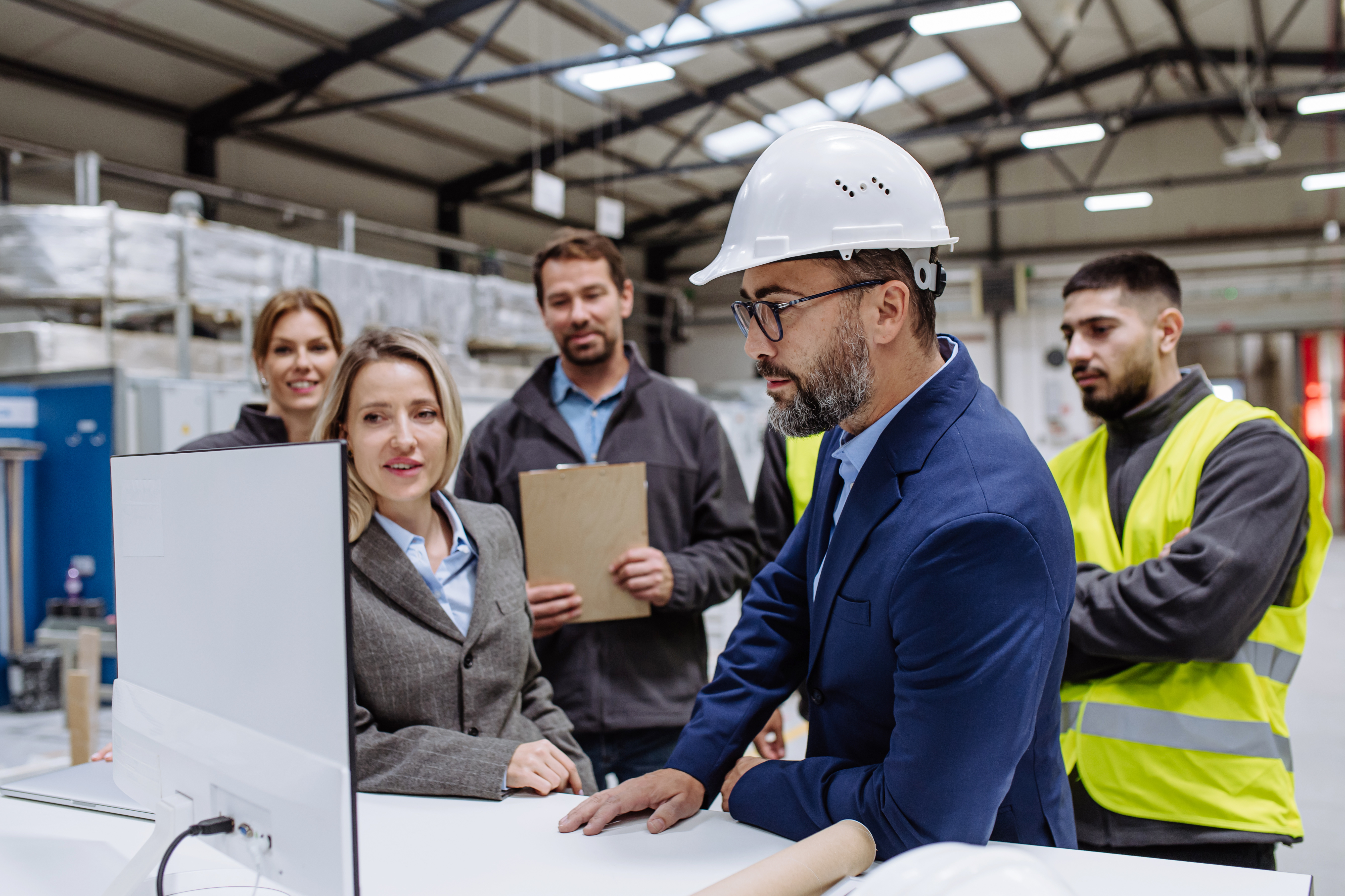 Construction project manager on-site with his team