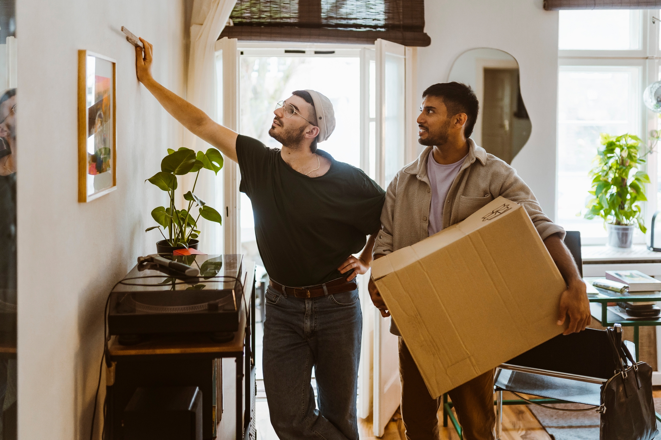 Two men moving into their new house