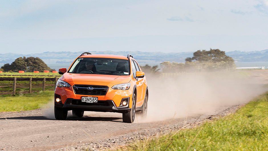 Orange Subaru XV front action