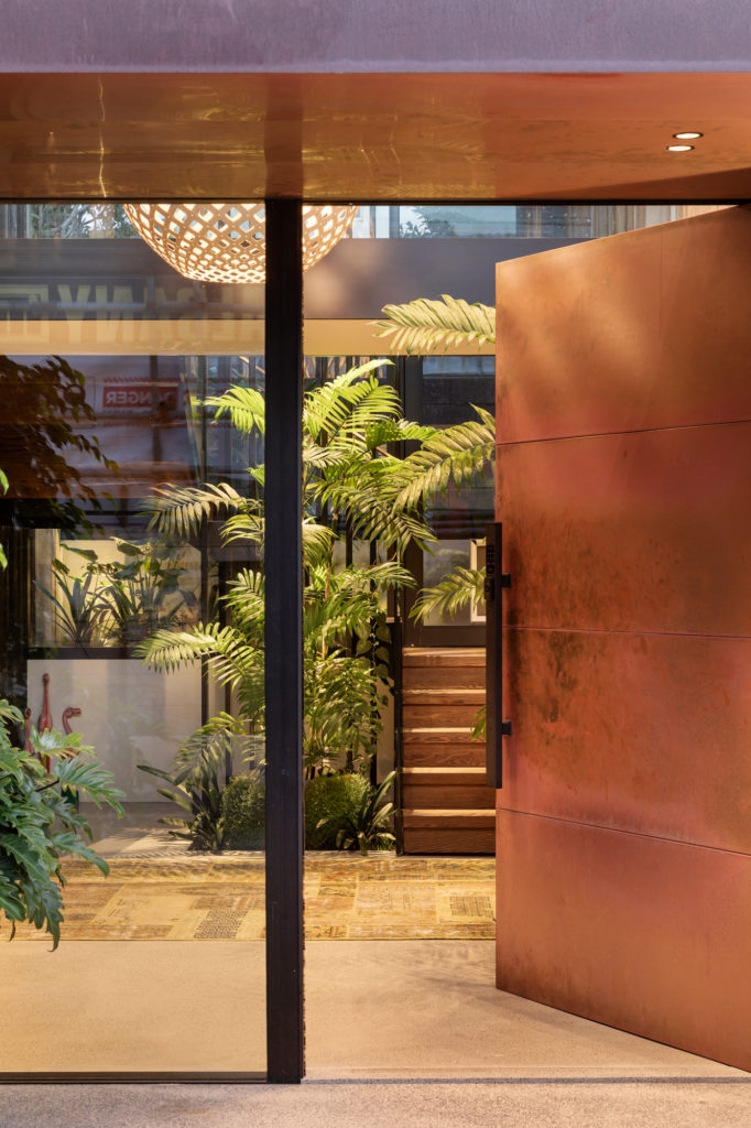 House on Takapuna Beach by CAAHT Studio incorporates an indoor garden, making a statement in the entrance foyer. Image: Sam Hartnett