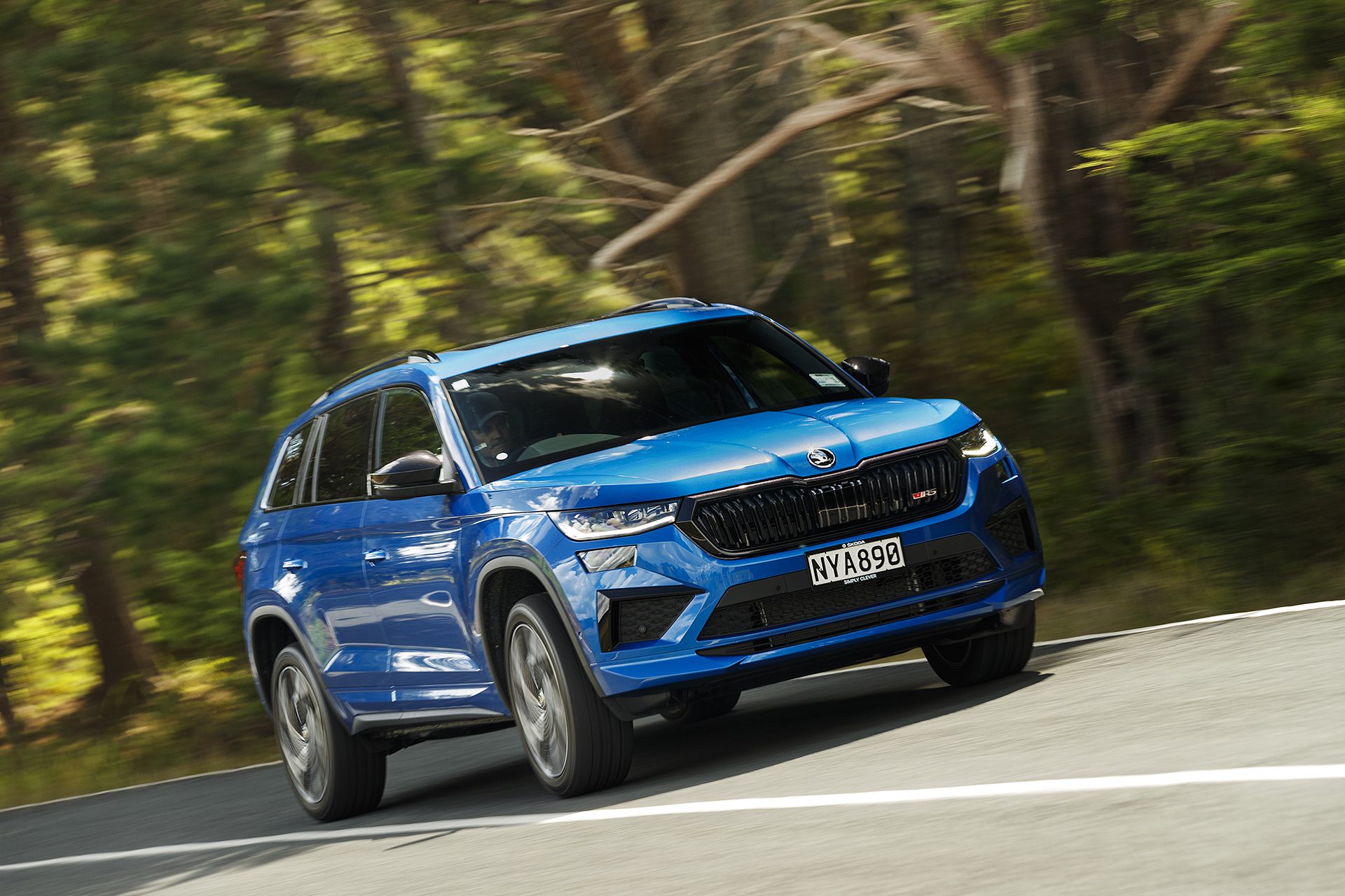 Blue Skoda Kodiaq RS action shot from the front.