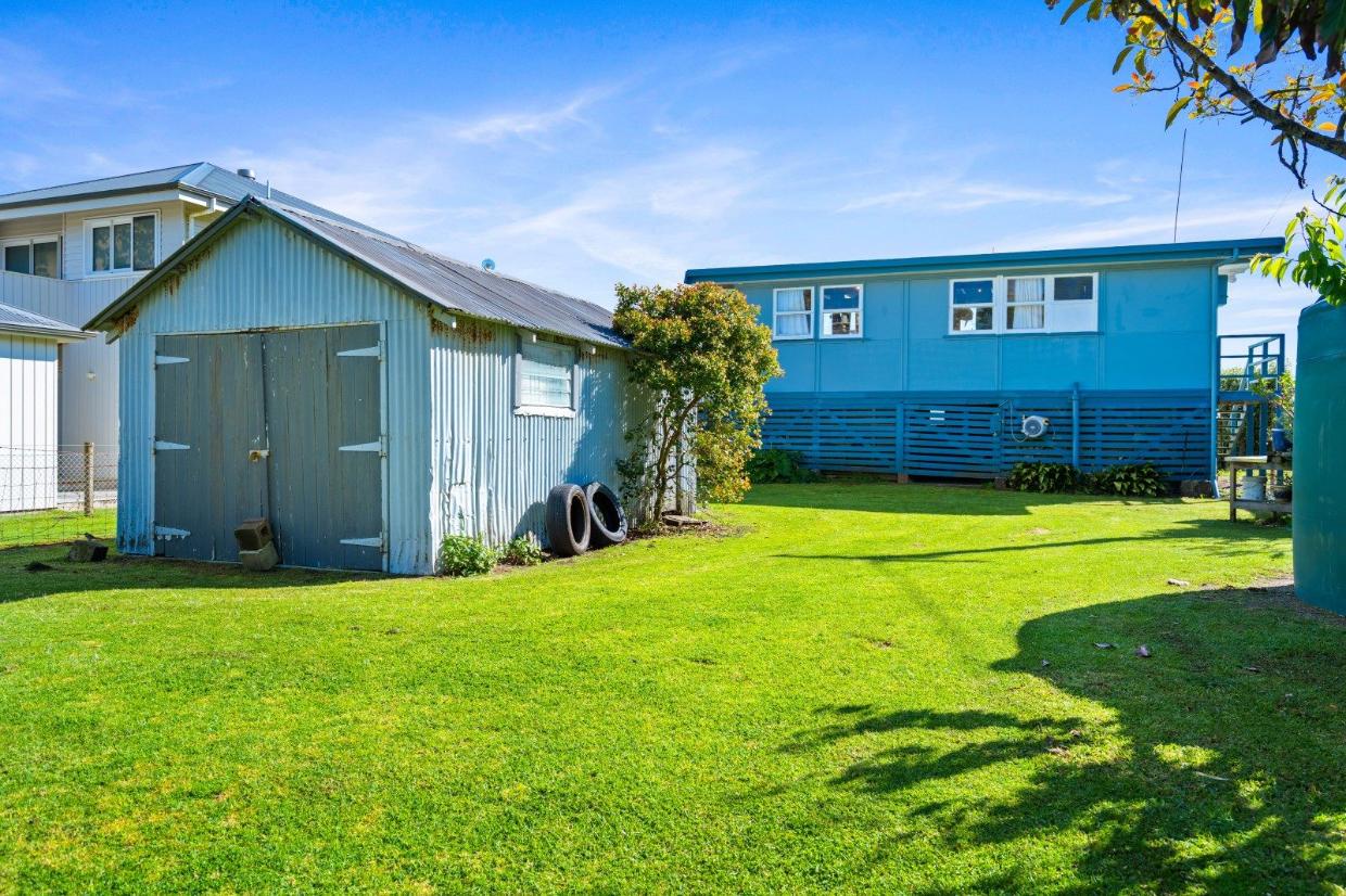 There is plenty of lawn around the bach - the section is 809m². Photo: Bayleys