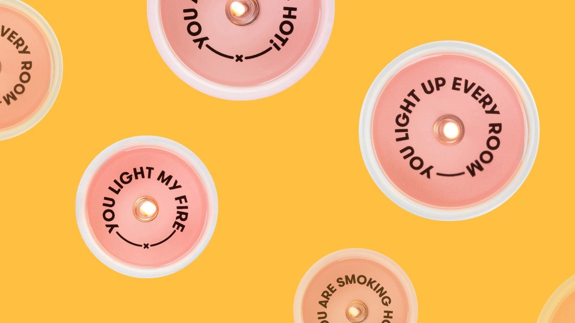 Secret message candles with "You light up every room" and "You light my fire" written on them