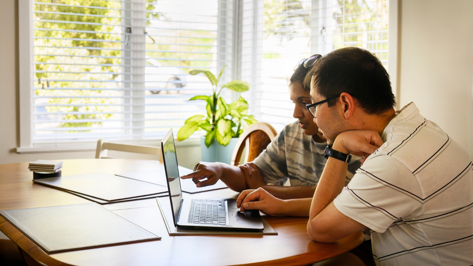 Couple looking at laptop. 