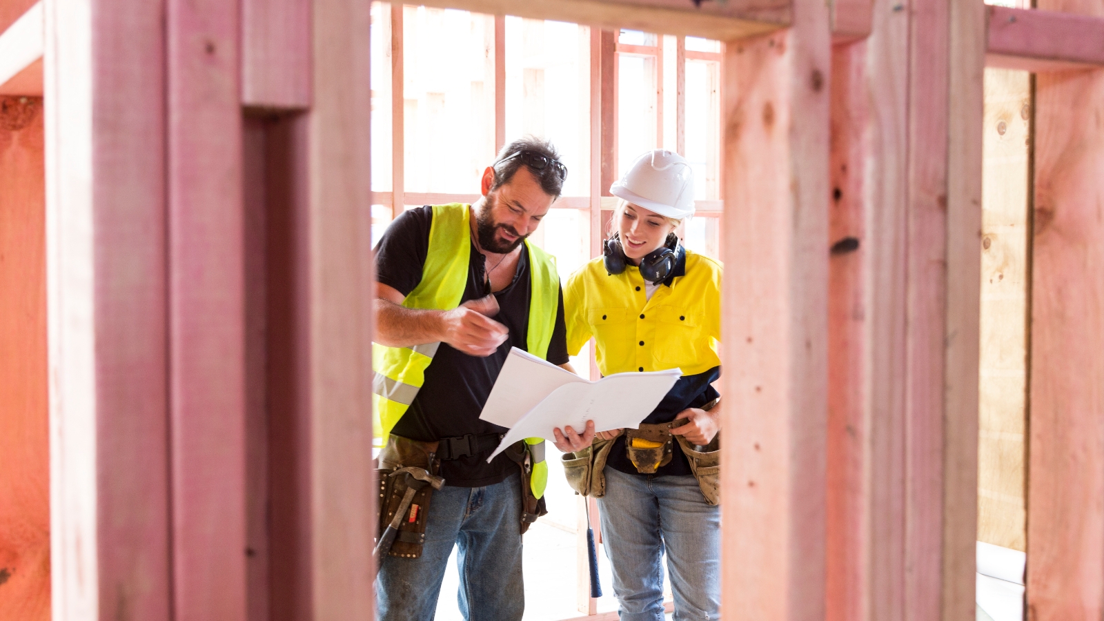 Builders looking at plan. 