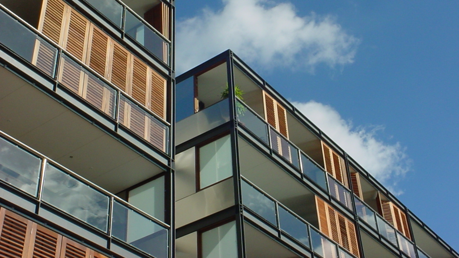 Apartments with wood panelling and balconies. 