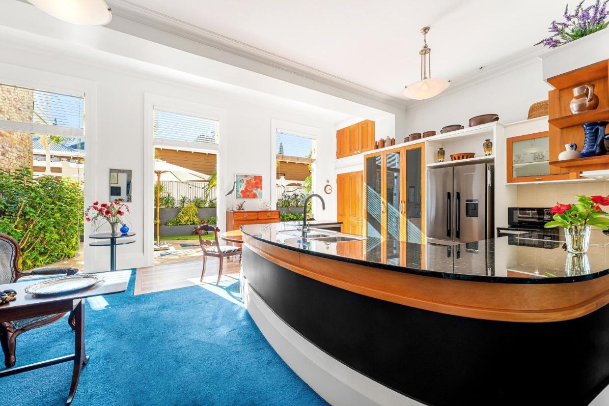 The large, curved kitchen peninsula is designed for easy entertaining.