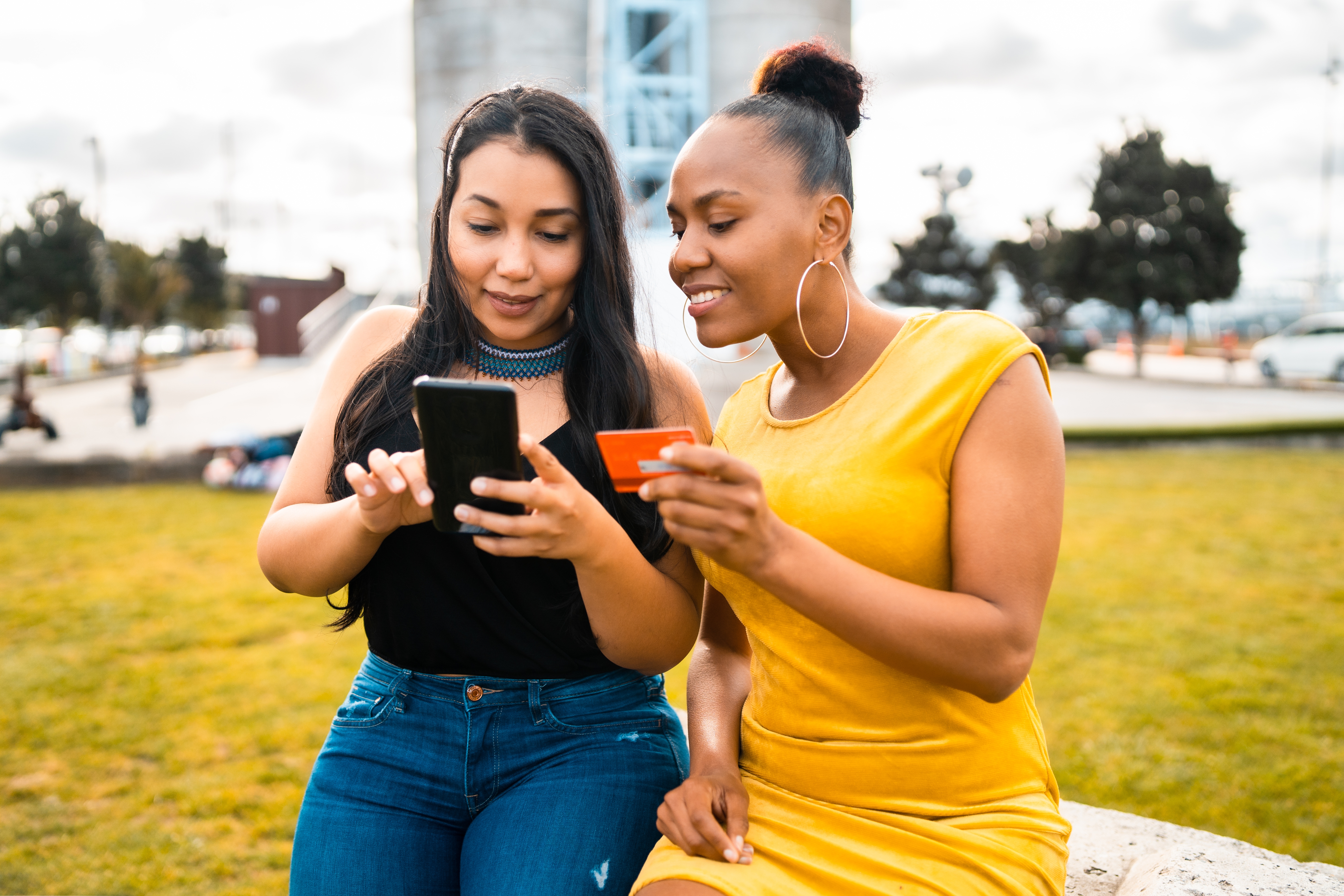 Two women looking on their mobile phones