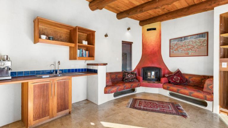 Built-in seating is a feature of most areas in the house. Photo: Bayleys