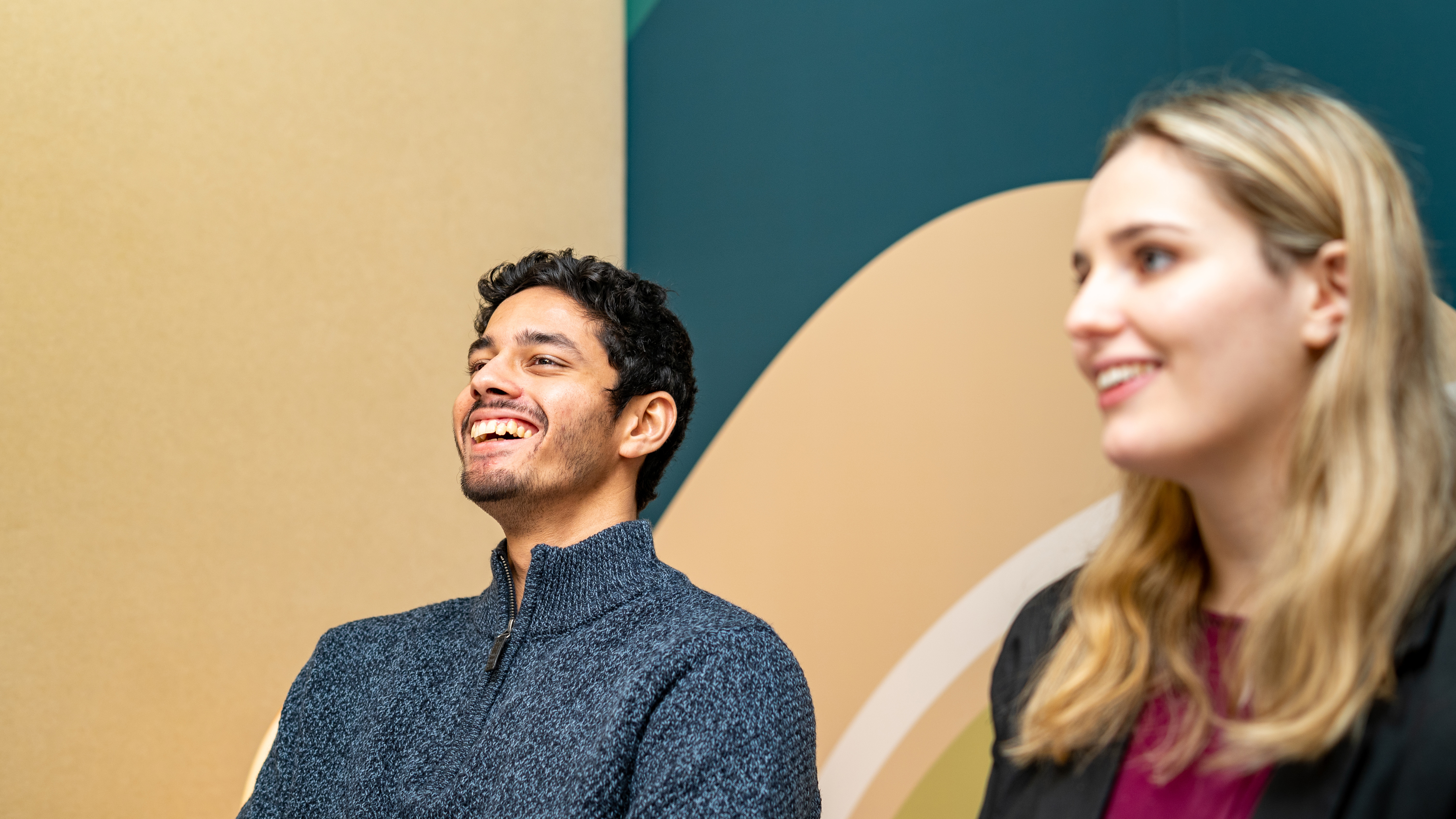 Employees smiling in a meeting