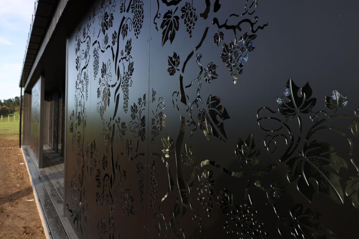 The exterior has laser cut panels with patterns.