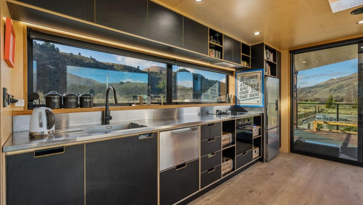 Stainless-steel benchtops in the kitchen. Photo: COLLIERS/TRADE ME