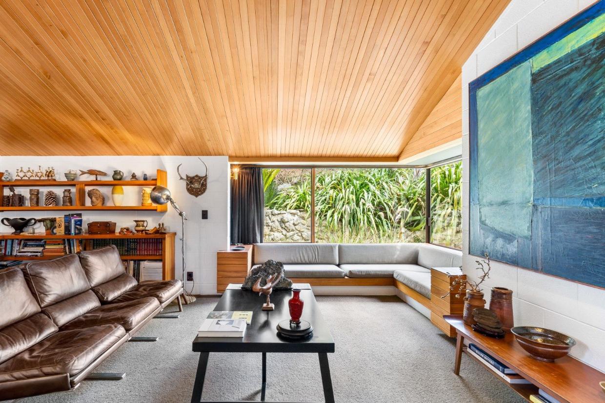 The living room with built-in window seat