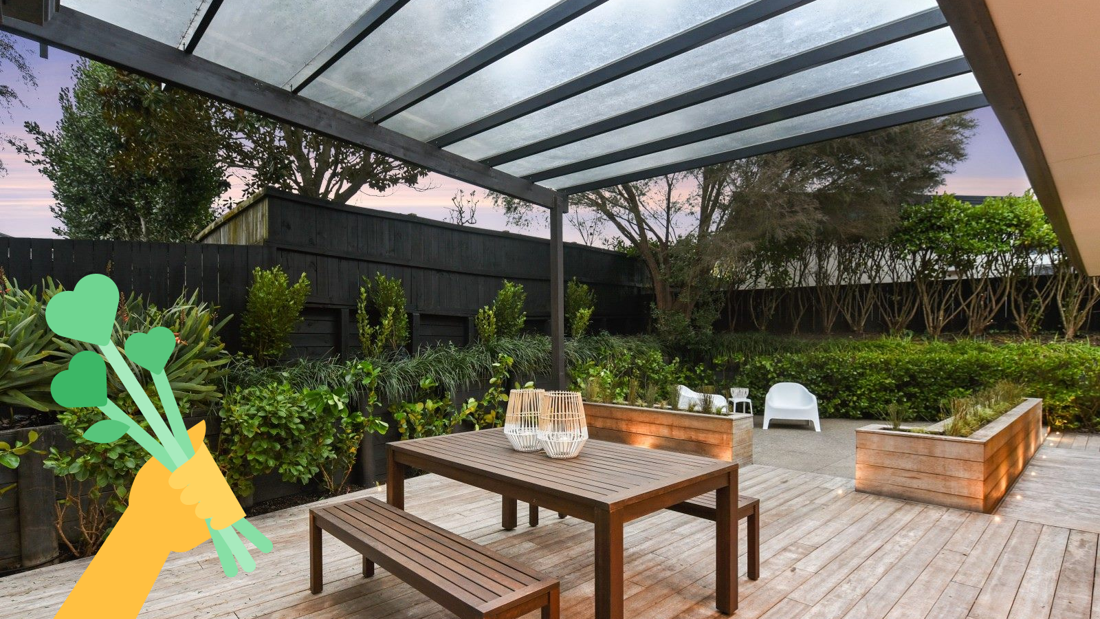 Outside area with a deck and pergola with a dining table and chairs