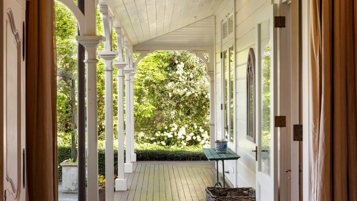 The home has a wide, wrap-around verandah. 
