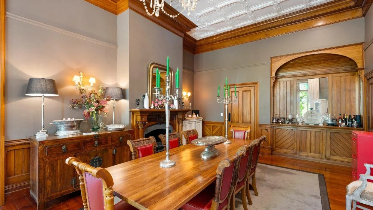 Dining room in the home is constructed from heart totara, with matai floors and rimu paneling.
