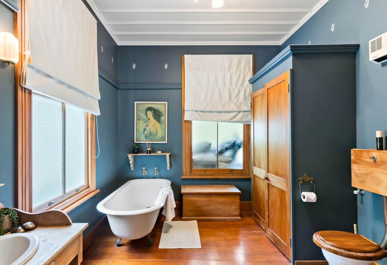 The bathroom retains a historic feel. 