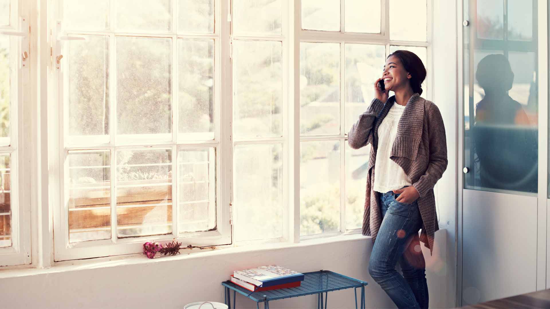 Woman making an offer on a property by phone.