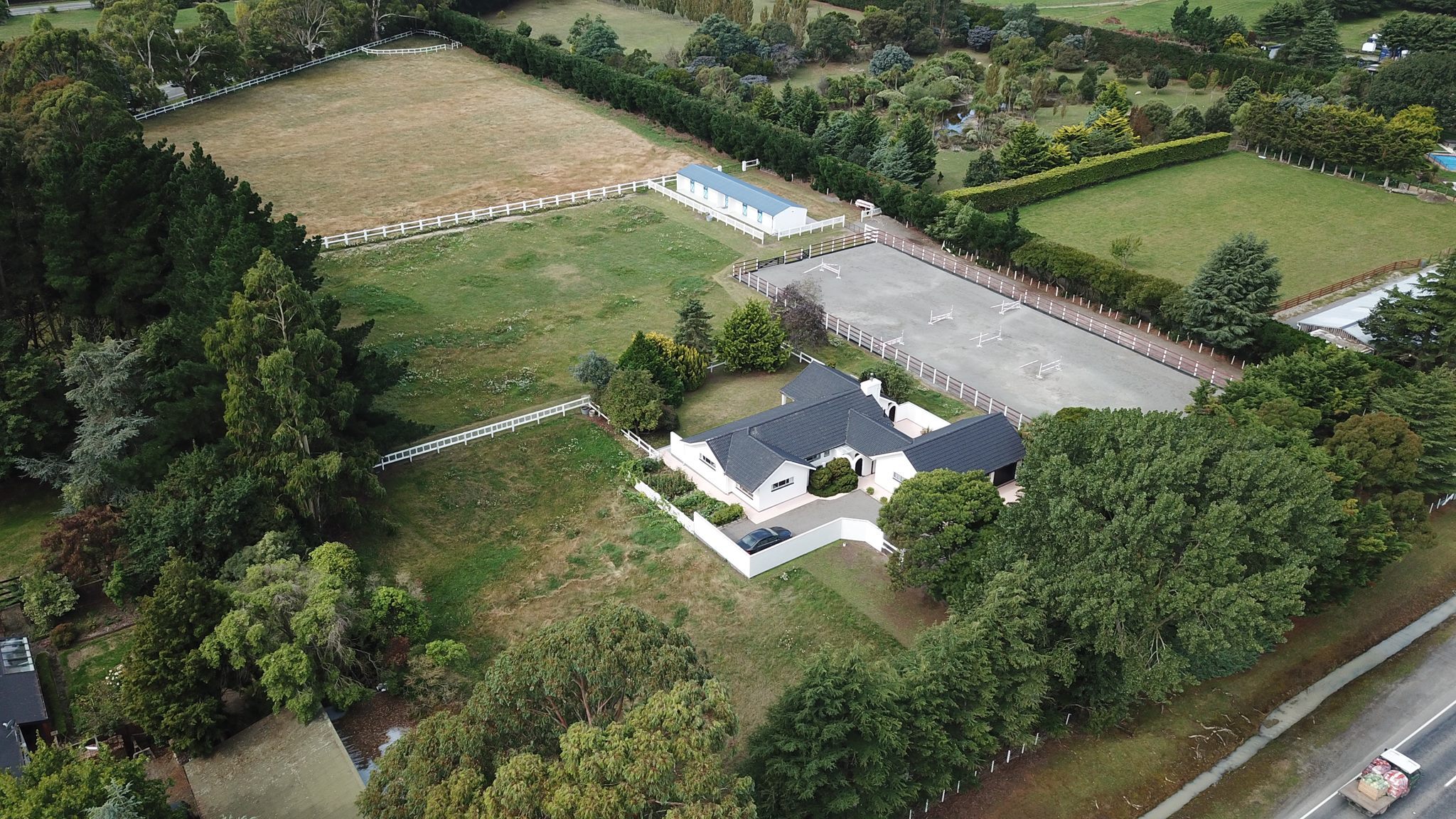 Aerial view of large Christchurch home with horse facilities