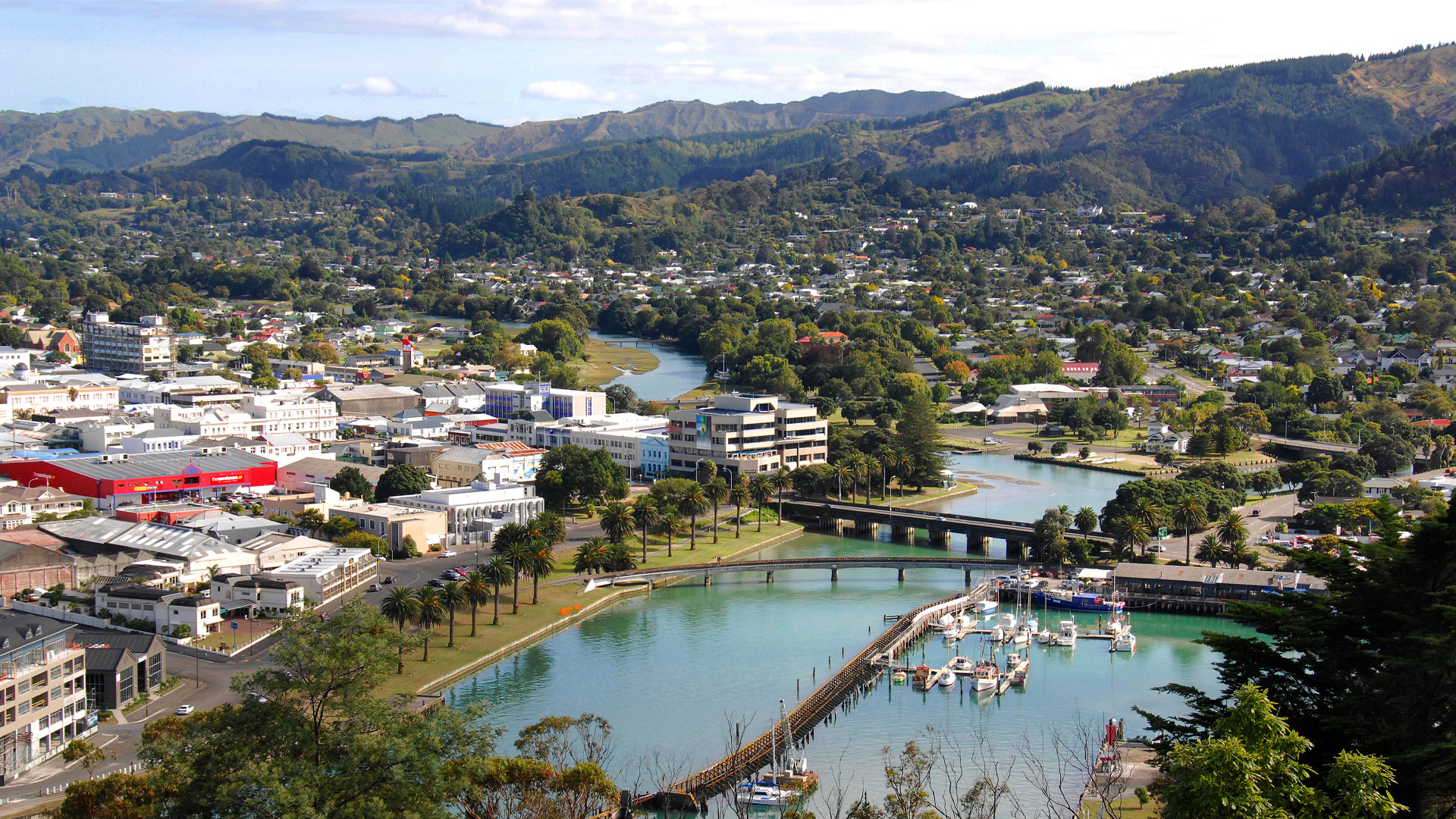 An aerial photo of Gisborne city showing the river and housing.