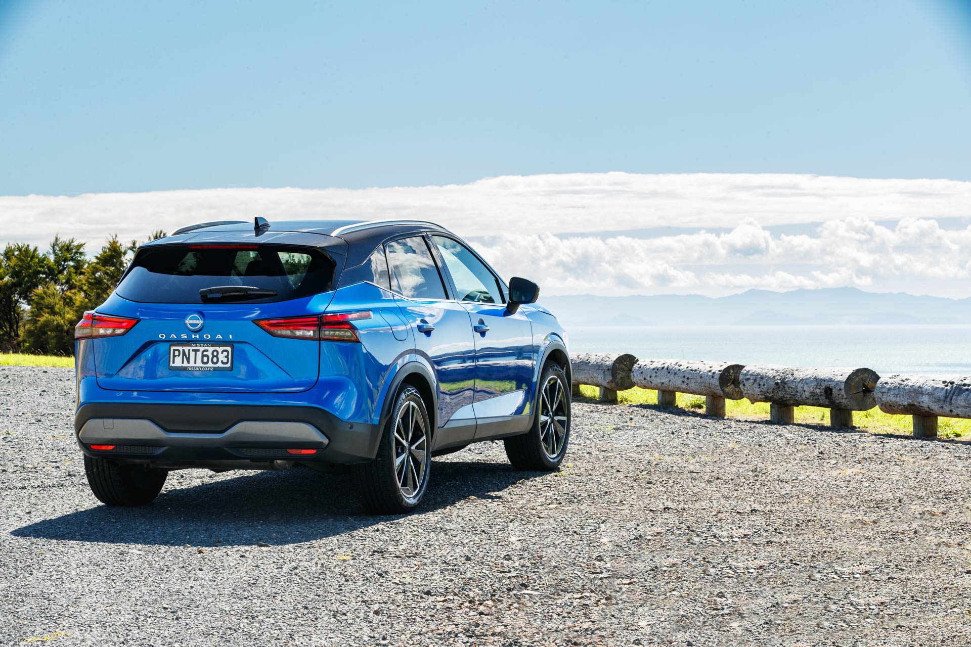 Blue Nissan Qashqai Ti static shot from the rear.