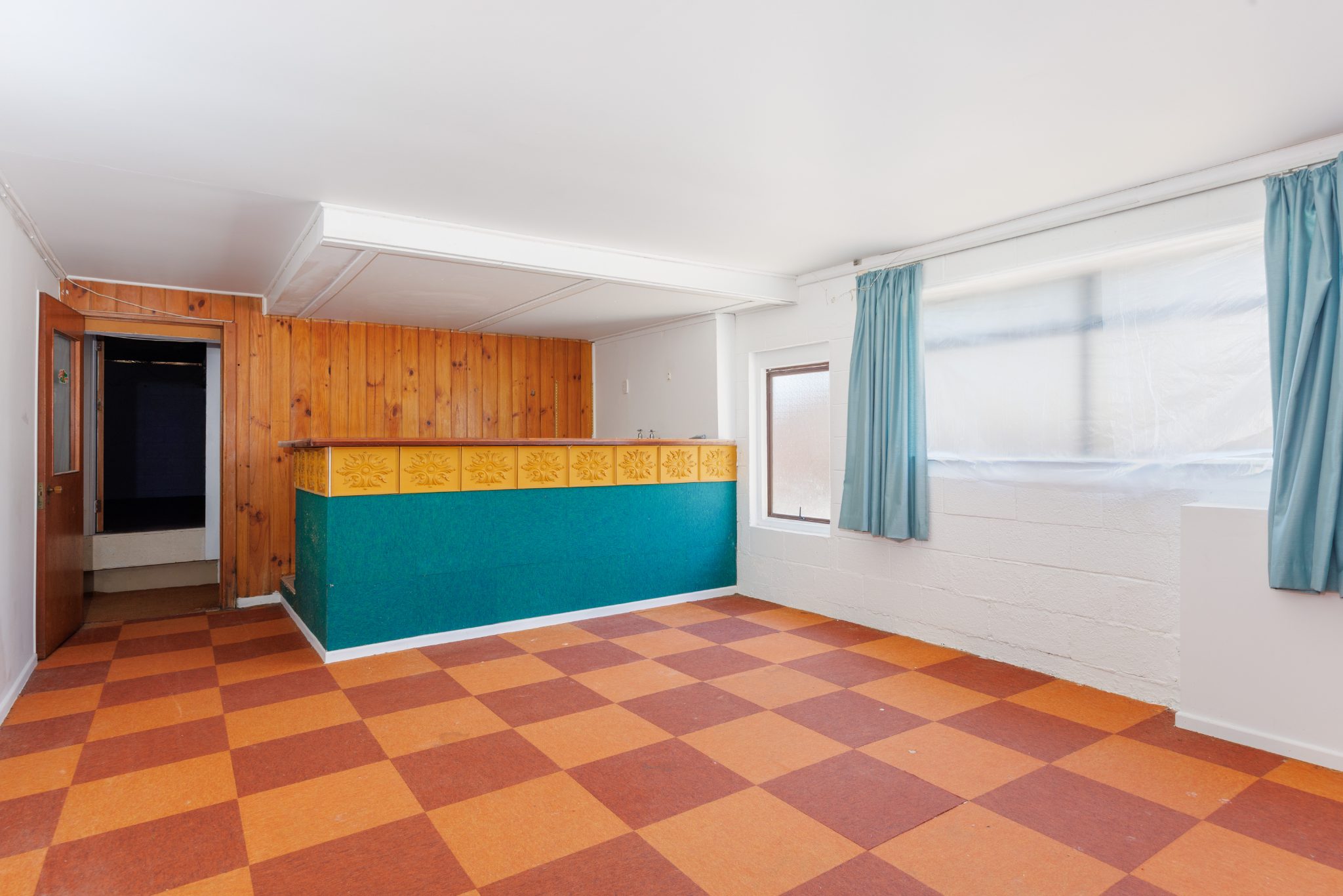 Photo of 1960s rumpus room featuring built-in bar