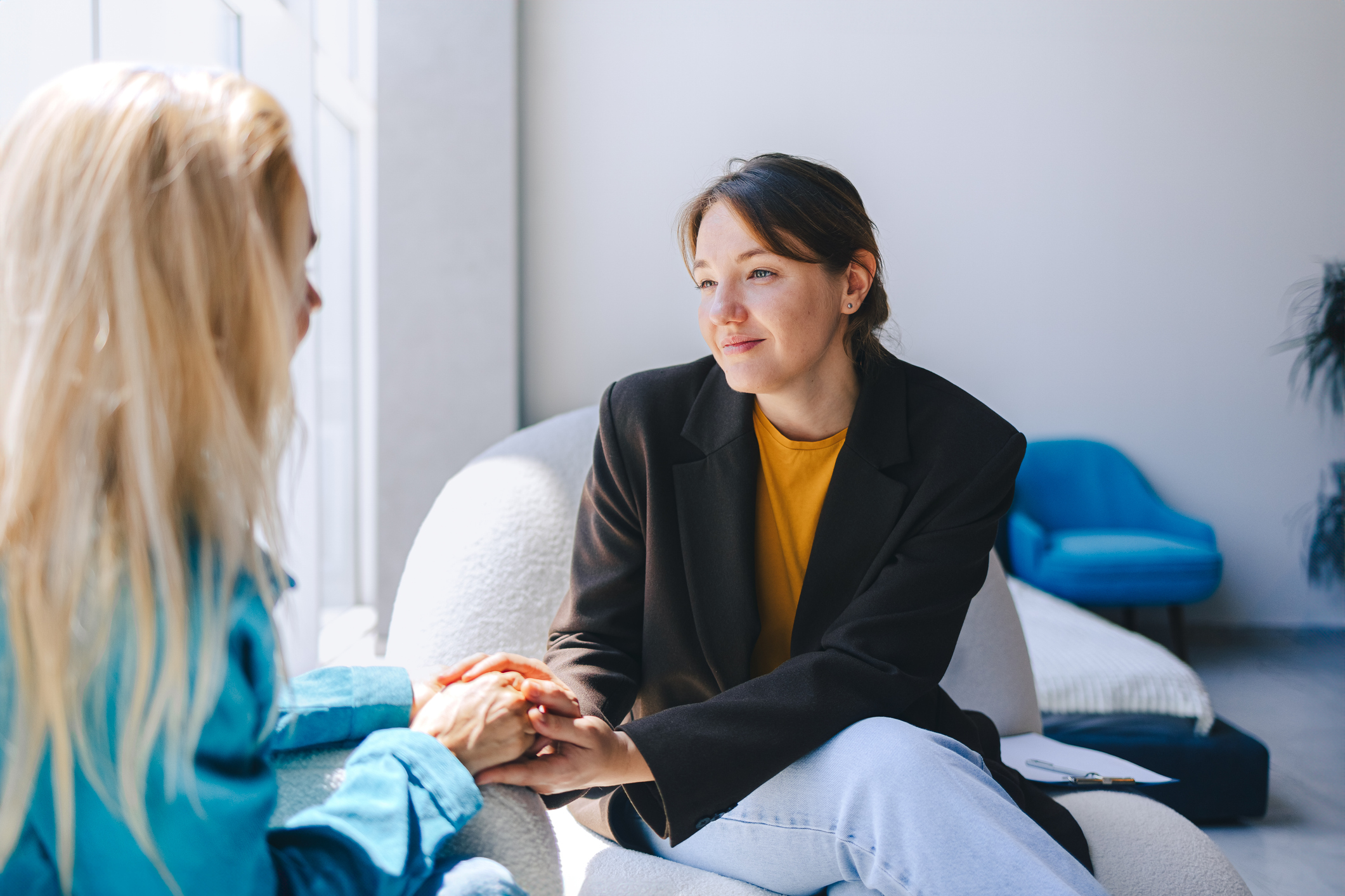 Female social worker comforting and supporting individual