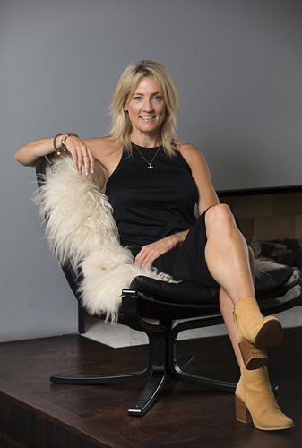 Jacqui Spice swinging in chair 