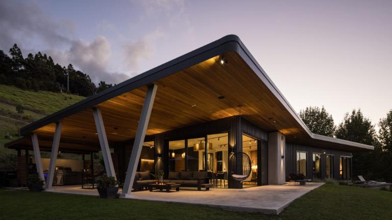 The bespoke home has a rural outlook but still close to Auckland. Photo: HARCOURTS/ TRADE ME