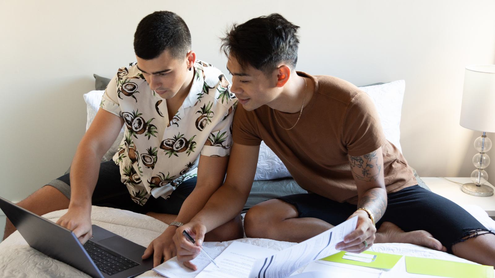 Two men paying bills