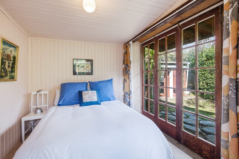 Bedrooms are lined with planks. Many boards around the house came from old railway buildings, including the Evansdale Railway Station. Photo: Nidd Realty