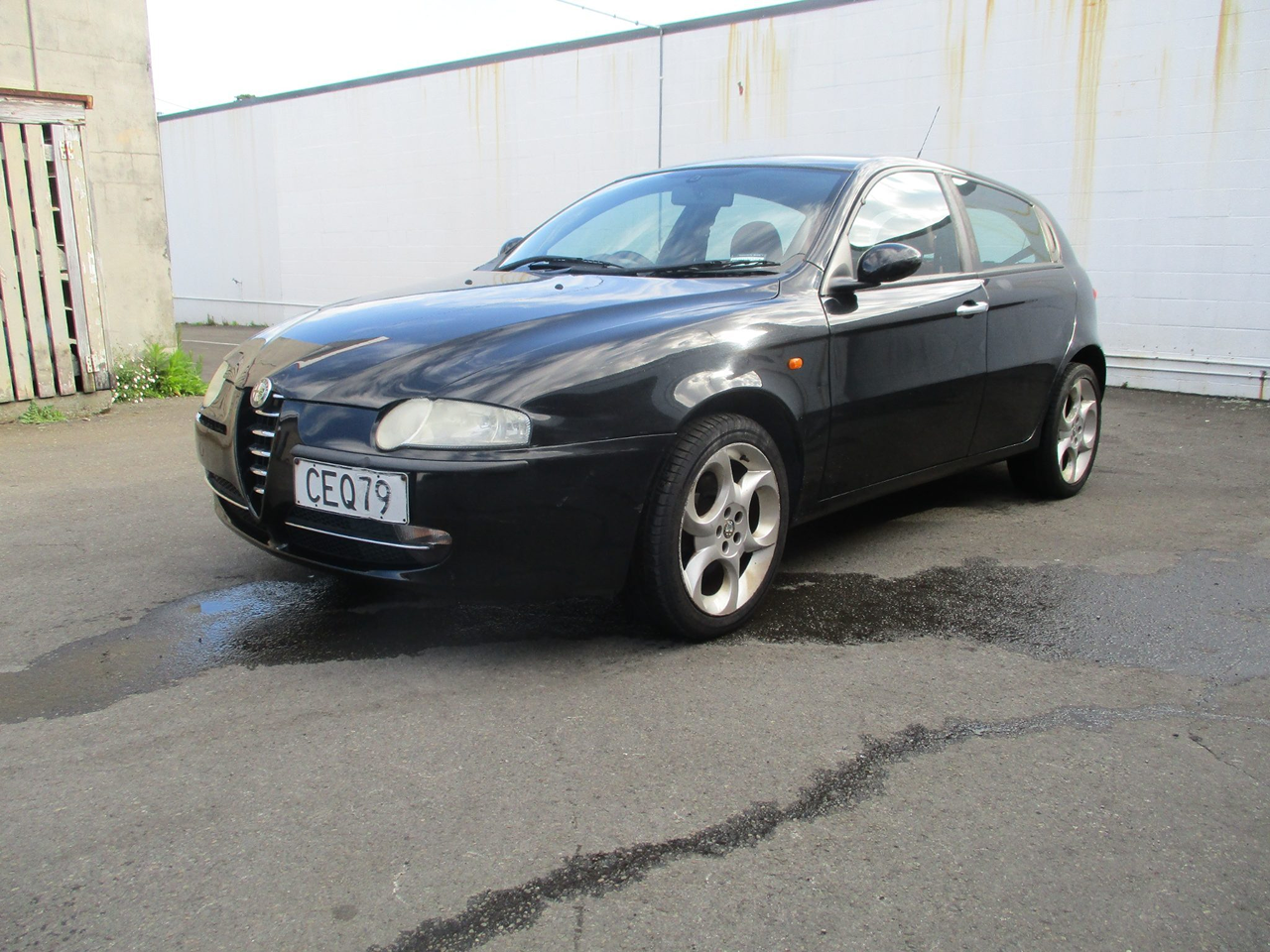 2004 Alfa Romeo 147 hatchback showing off its classic triangular front grille