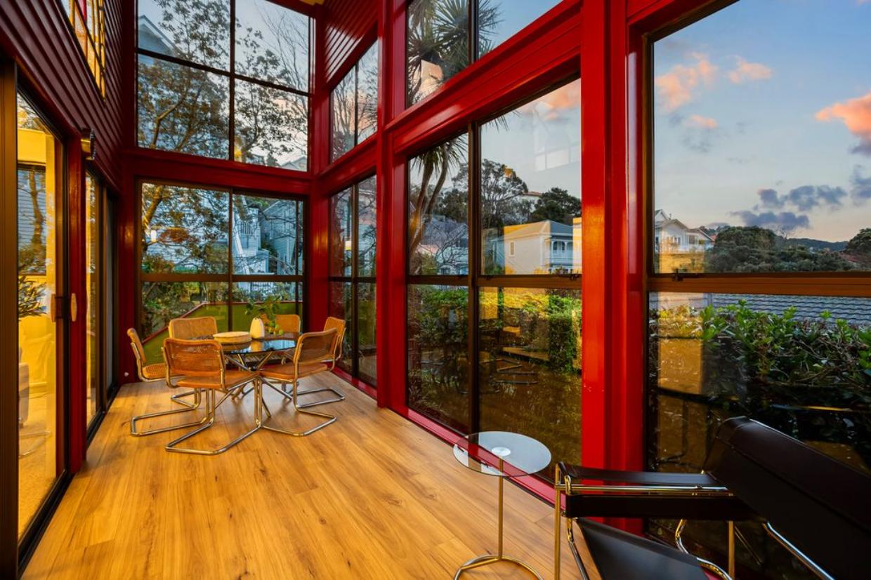The double-height sunroom is off the living area. Photo: Harcourts