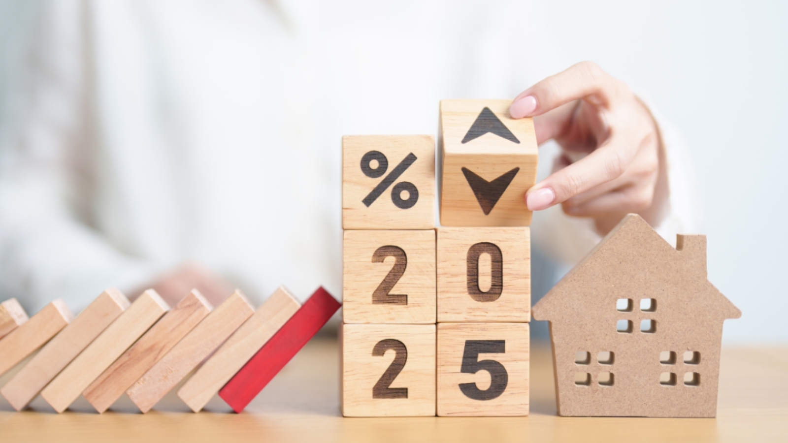 Image showing dominoes and the numbers 2025 and a % sign. 