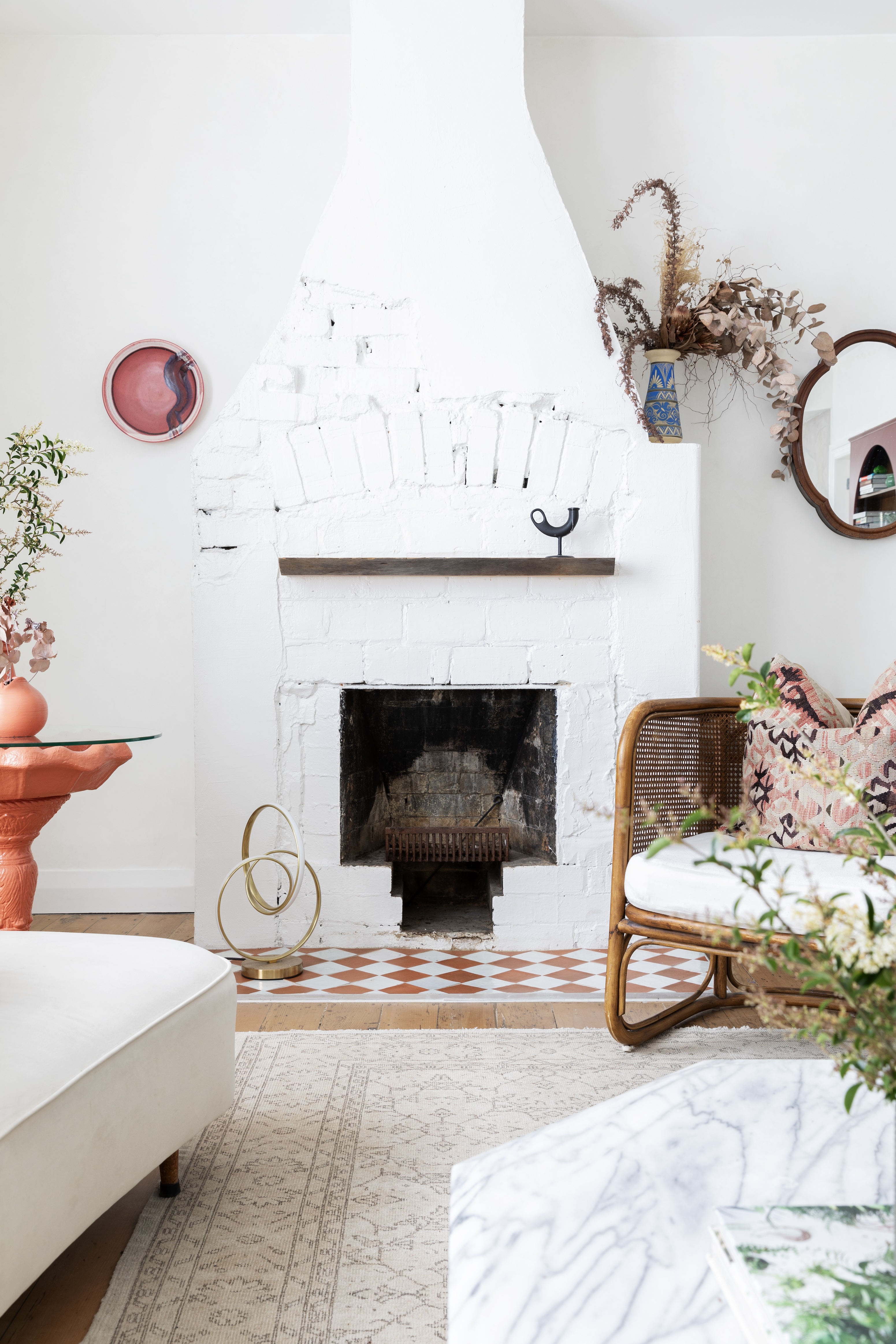 Although the main living area is open-plan, Gretchen enjoys the embracing feel of distinct areas within that, and uses substantial pieces to ground each zone before adding small vignettes. Lots of vintage has worked its way into this home, and in the lounge, almost everything is second-hand.