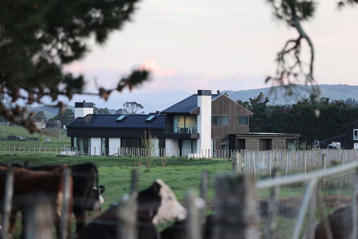 Ōamaru stone makes a stark contrast to black charred timber on the exterior, as it highlights the distinctive vertical elements of the house. Photo: Frances Oliver