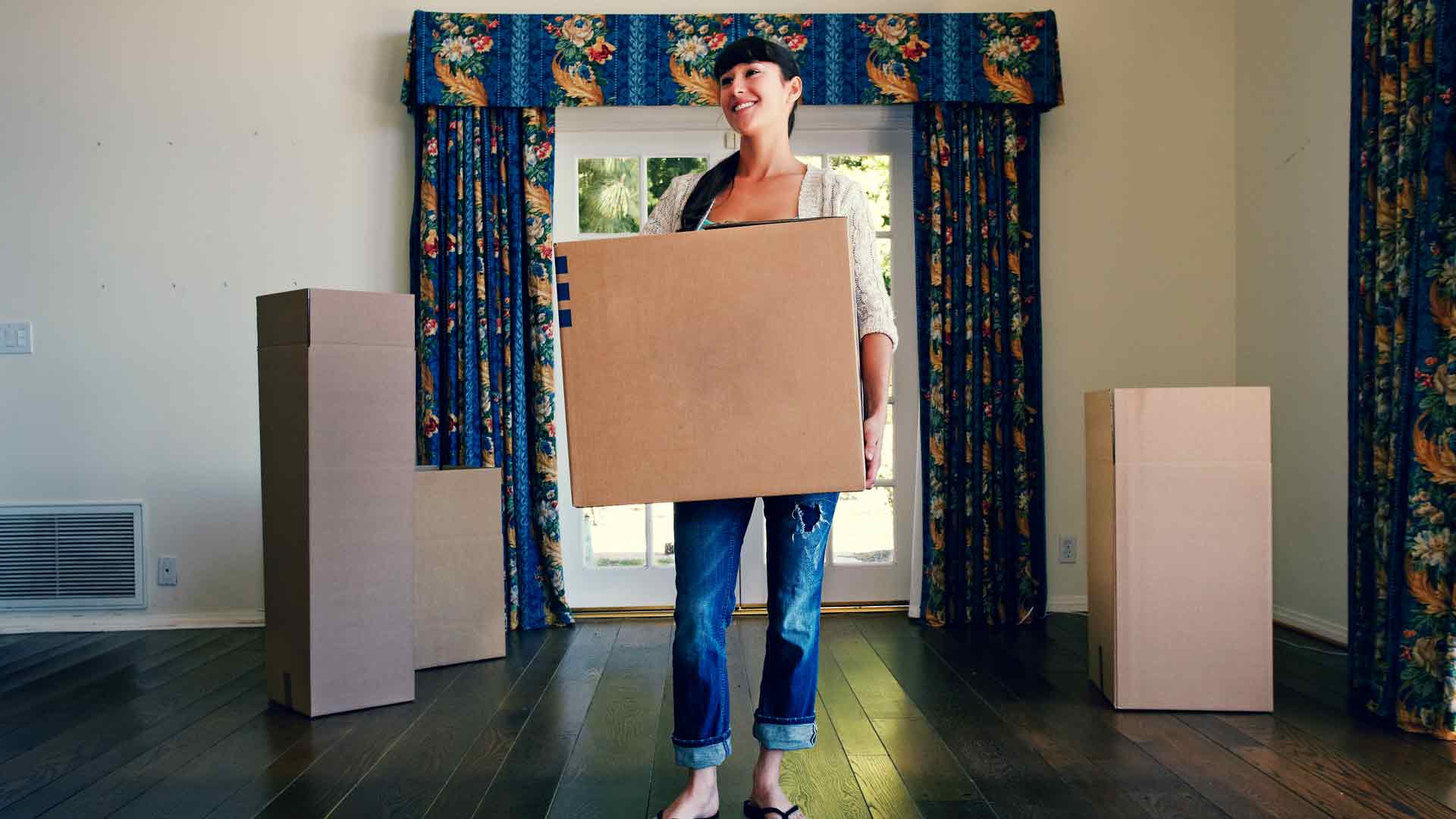 Young woman moving into her first home.