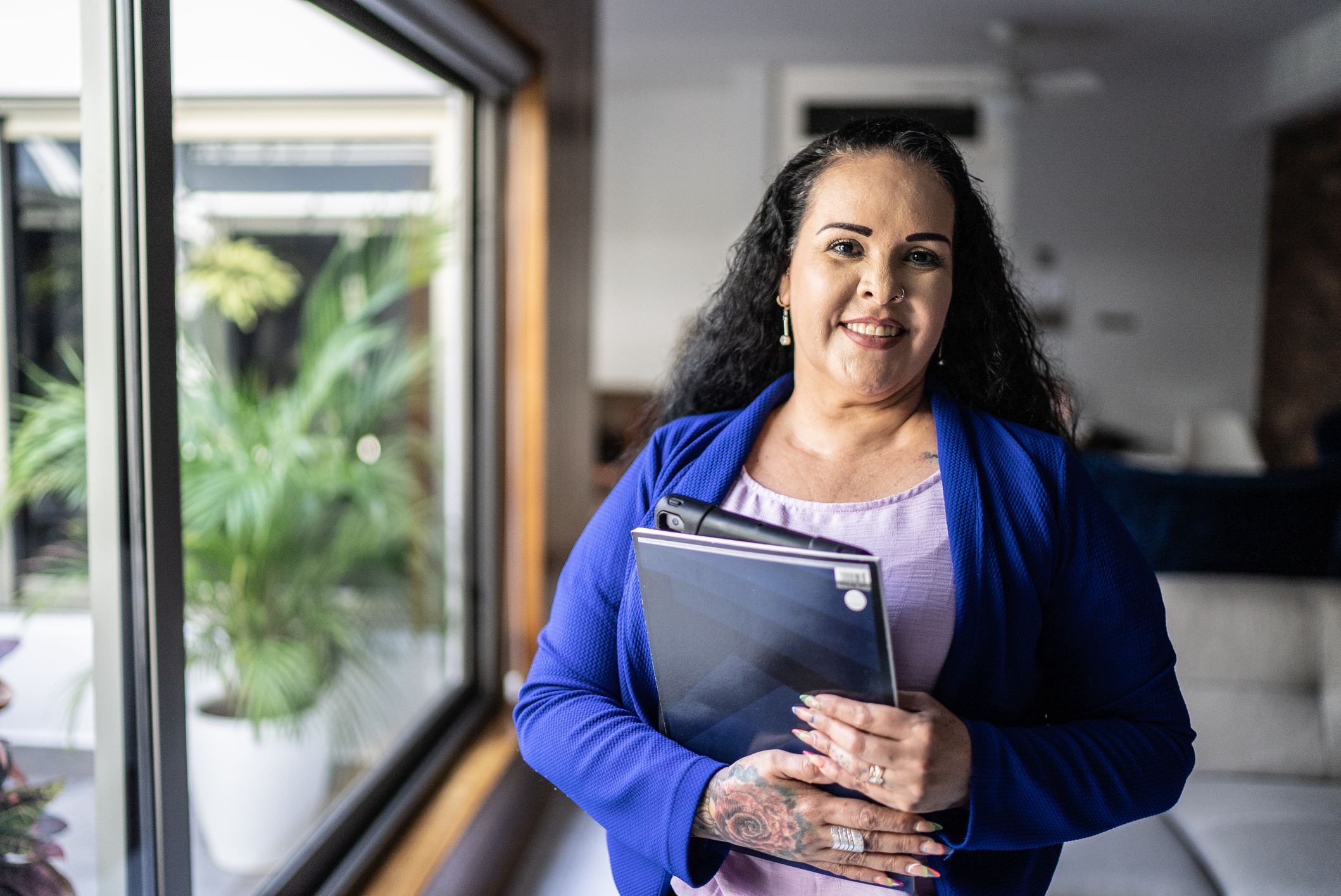 Woman holds her laptop