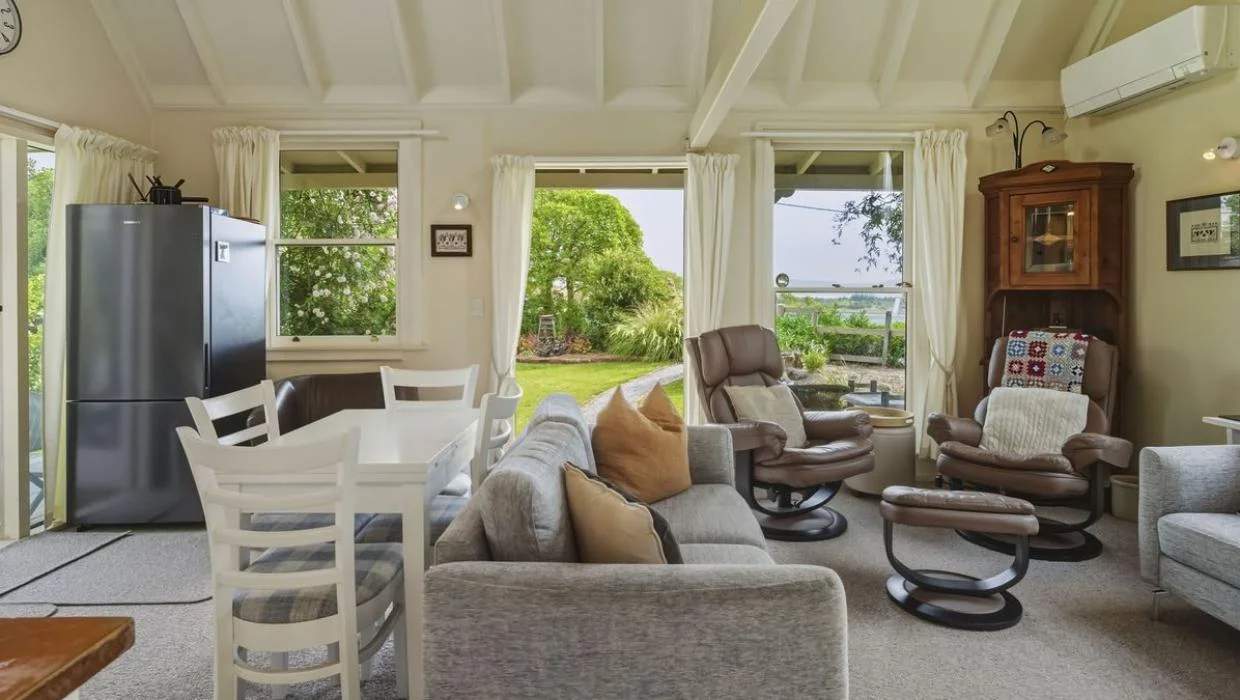 Exposed beams that follow the roofline reinforce a sense of space in the tiny crib.